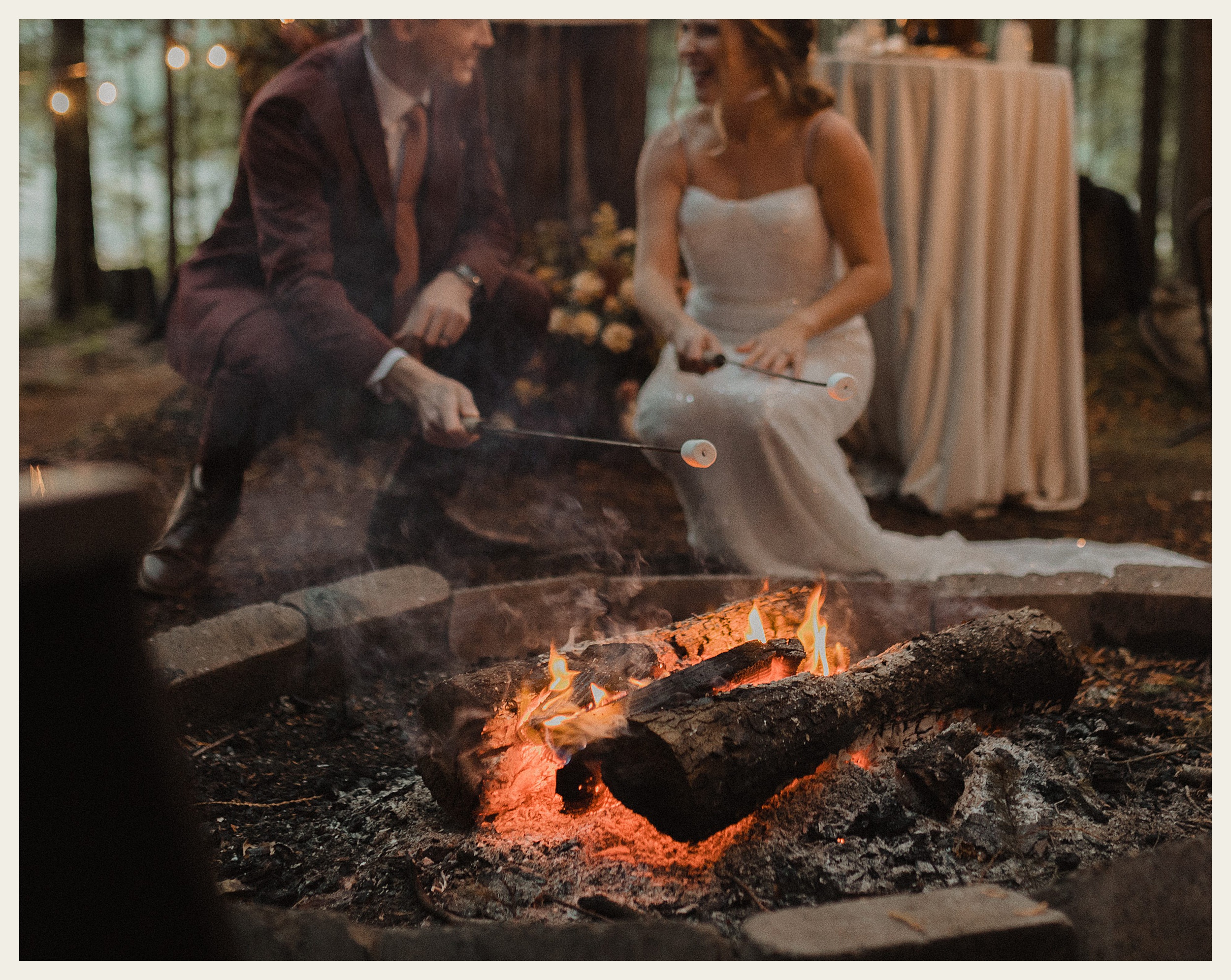 bride and groom roasting marshmallows 
