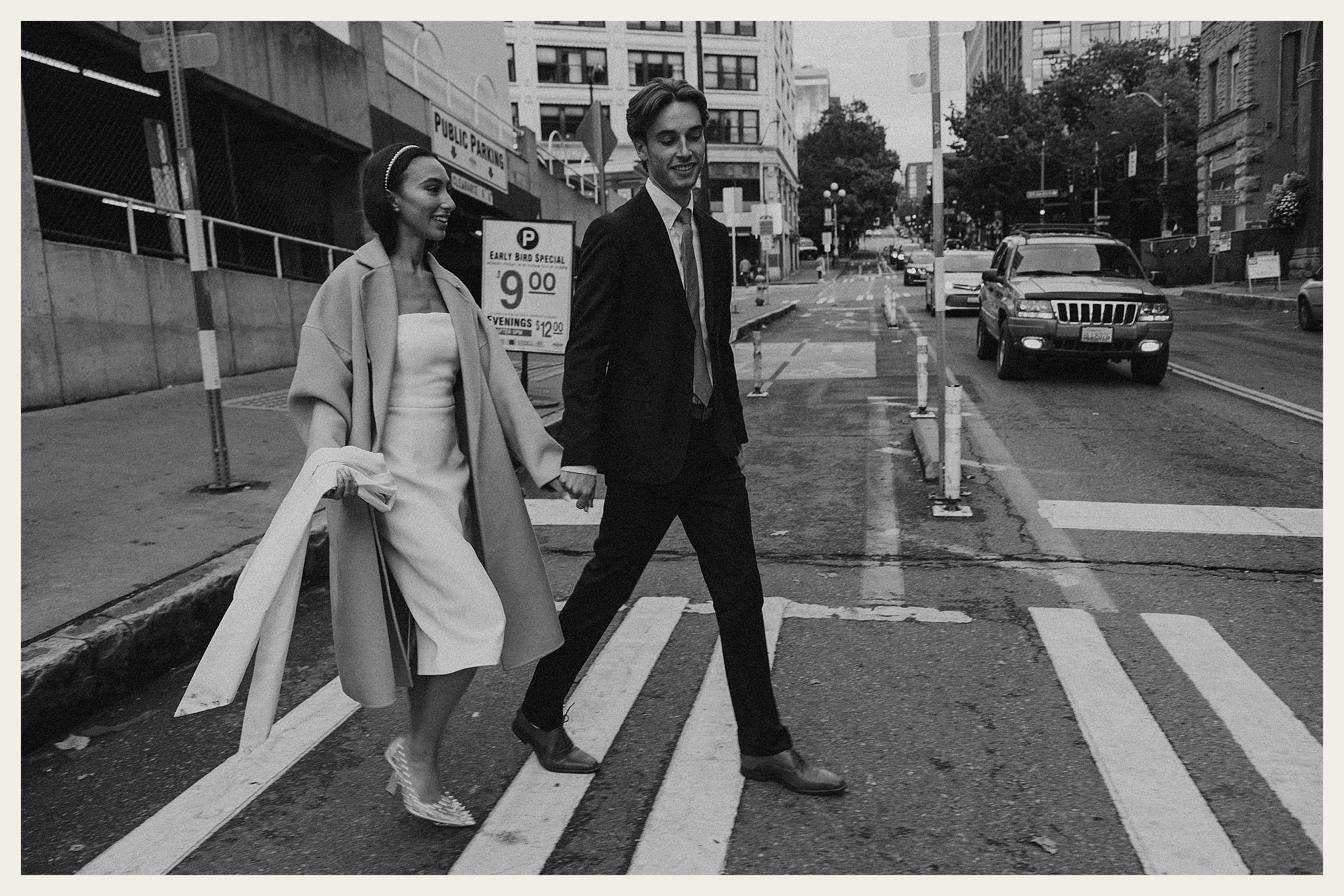 bride and grrom walking across street downtown seattle 