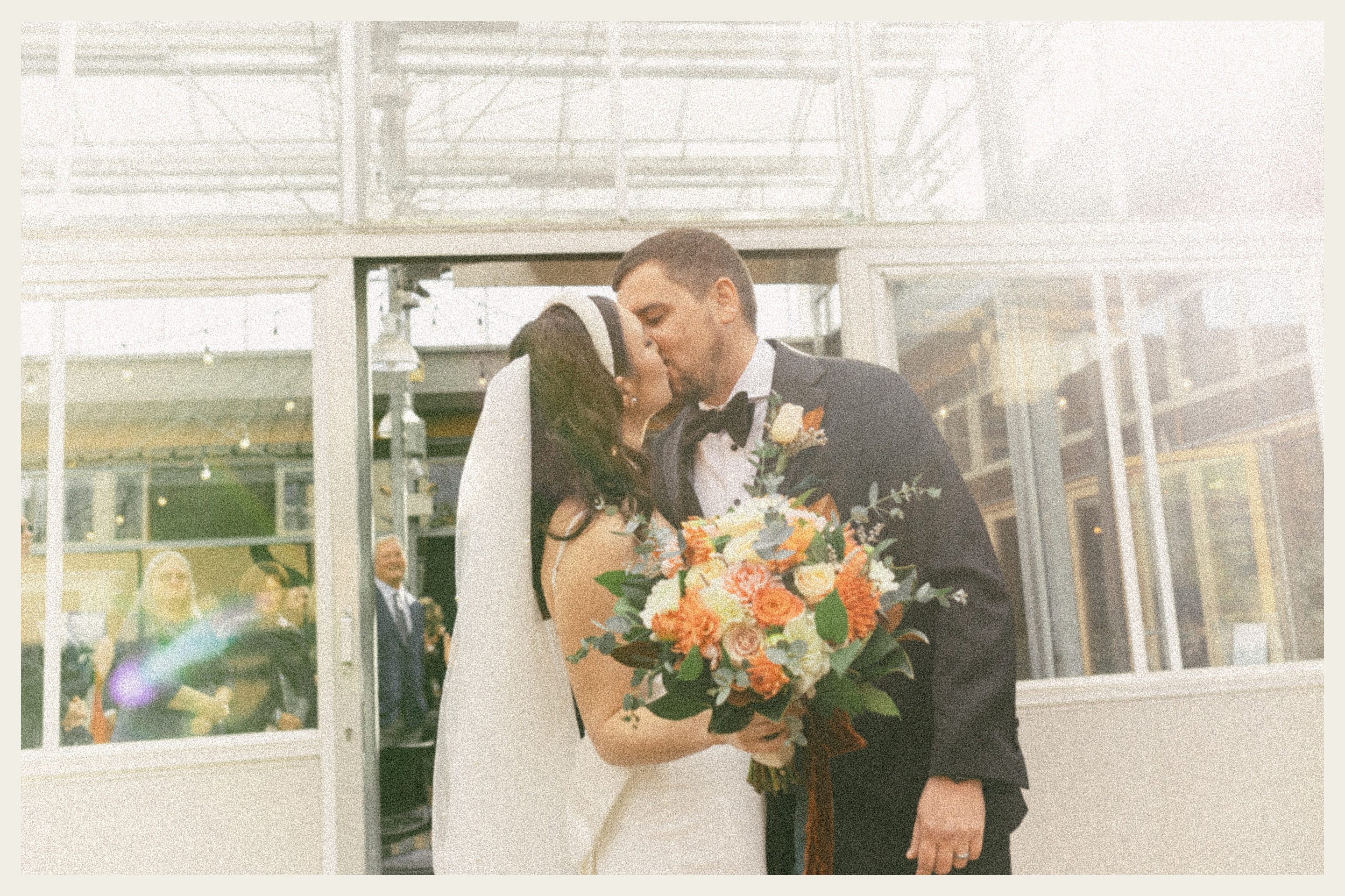 bride and groom kissing UW horticulture center 
