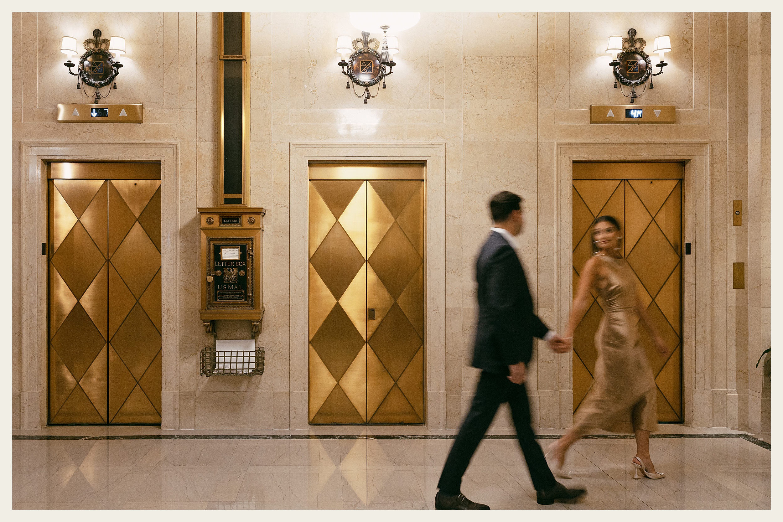 couple walking by elevators