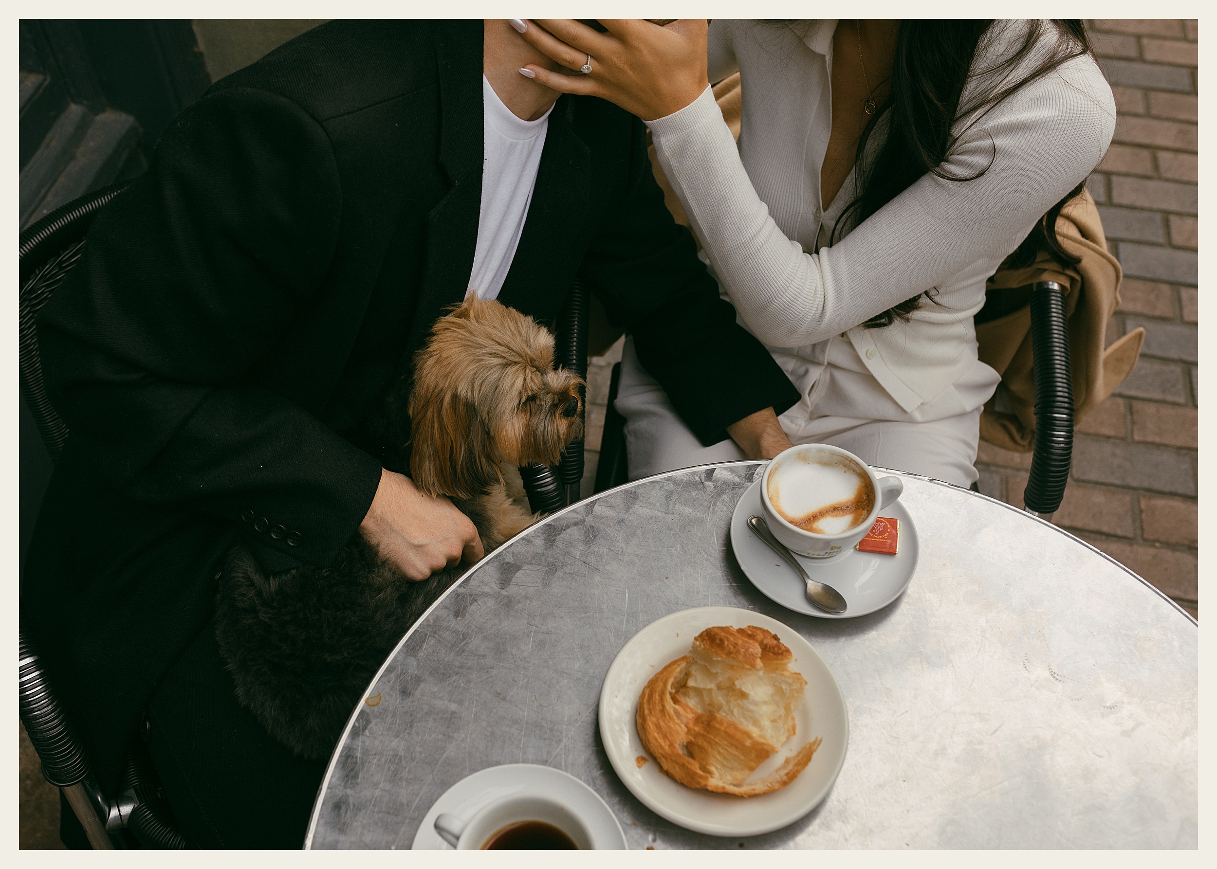 couple at coffee table with dog